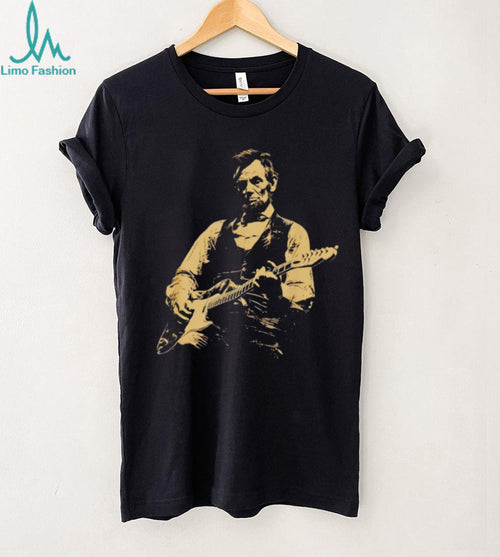Abraham Lincoln playing electric guitar on a black cotton crew neck unisex shirt