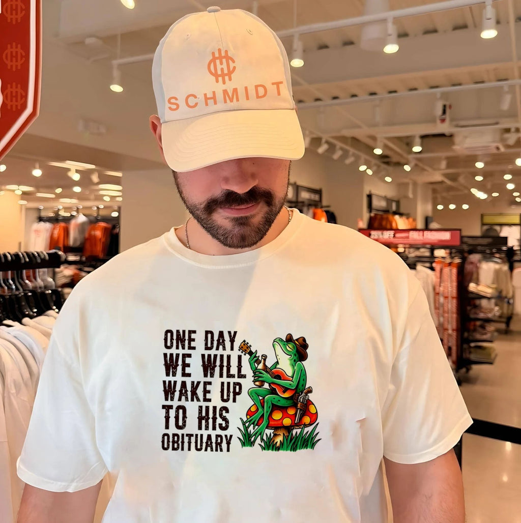 One day we will wake up to his obituary cartoon frog shirt